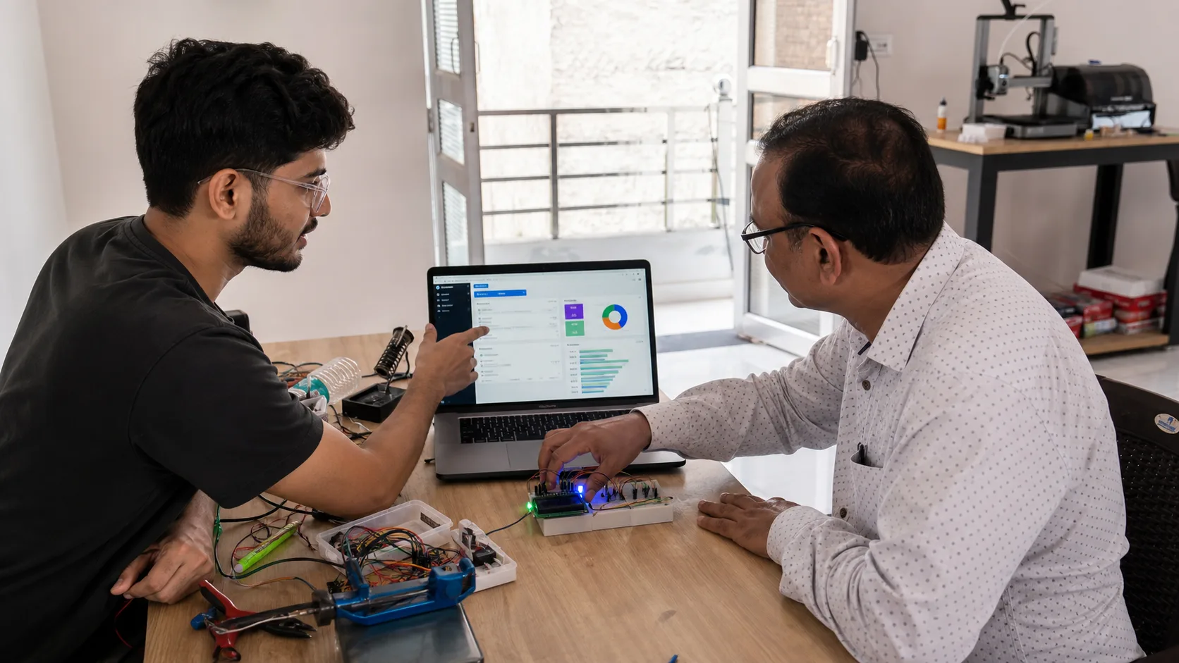 Illustrative view of a builder reviewing a connected prototype with a local client